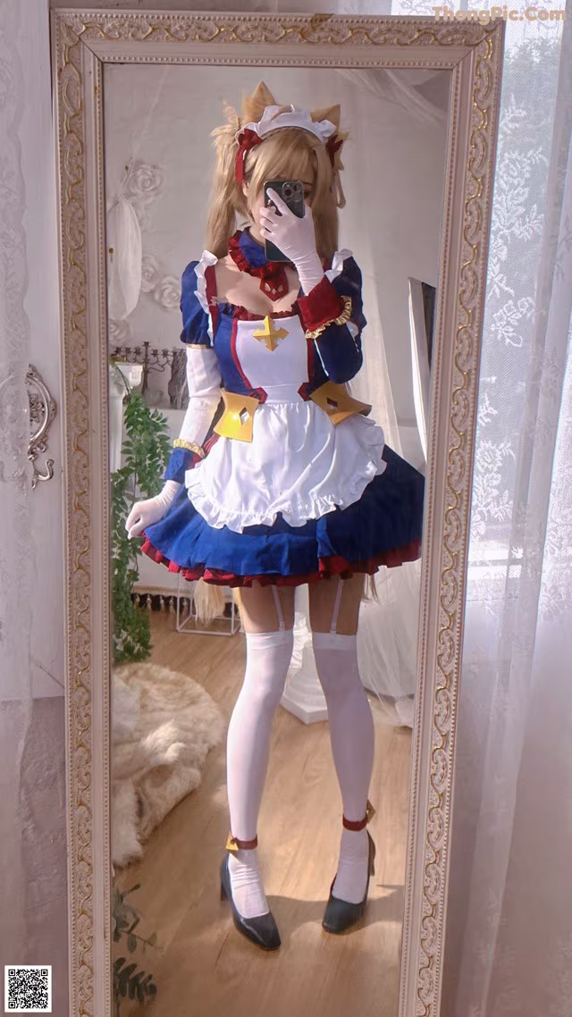 A woman taking a picture of herself in a mirror.